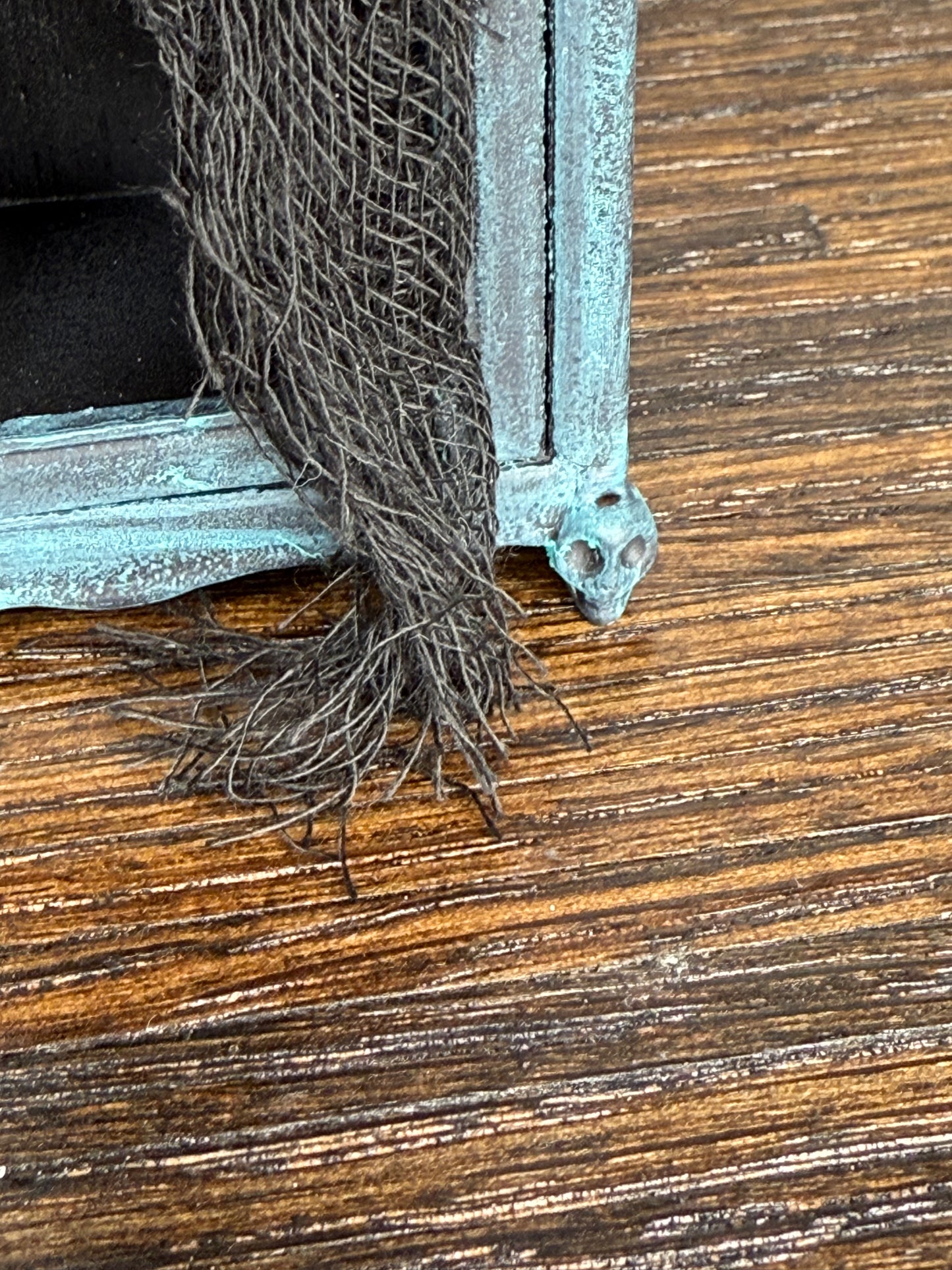 Empty Tarnished and Black Armoire with Skull Front Feet and Black Net Curtains