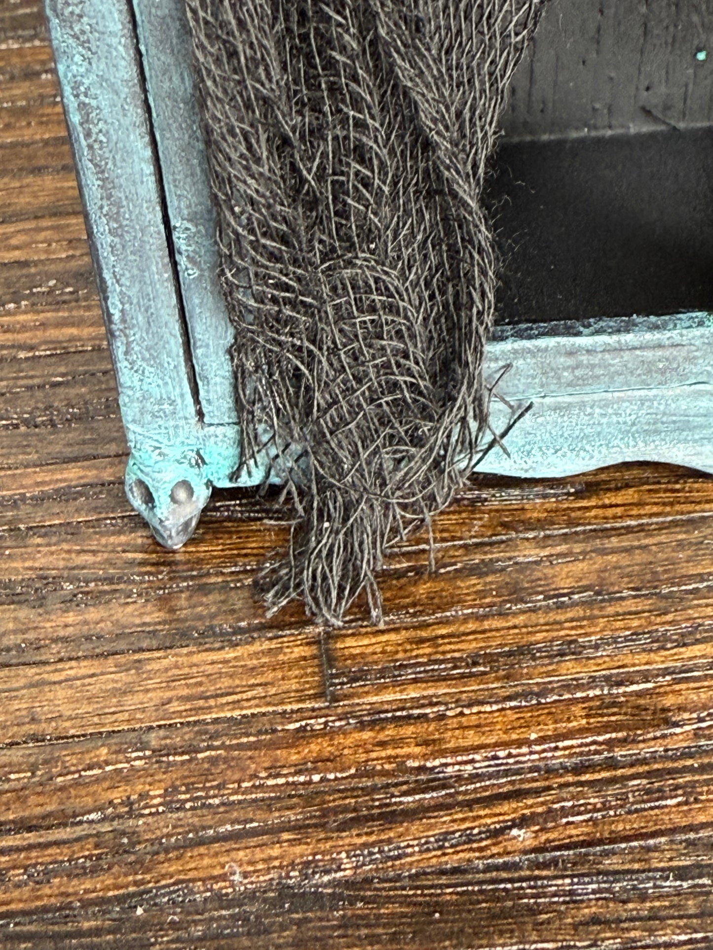 Empty Tarnished and Black Armoire with Skull Front Feet and Black Net Curtains